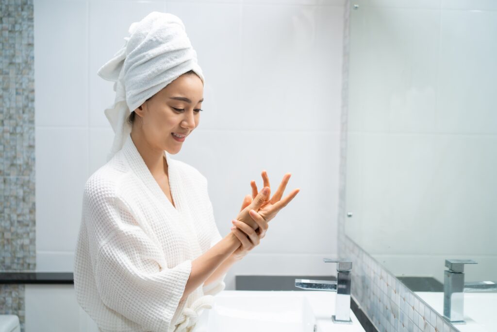 woman applying anti aging cream