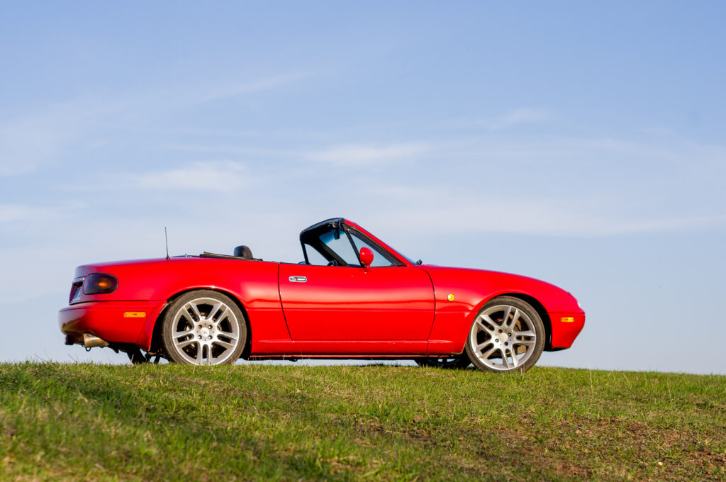 Mazda mx-5 standing on the hill springtime