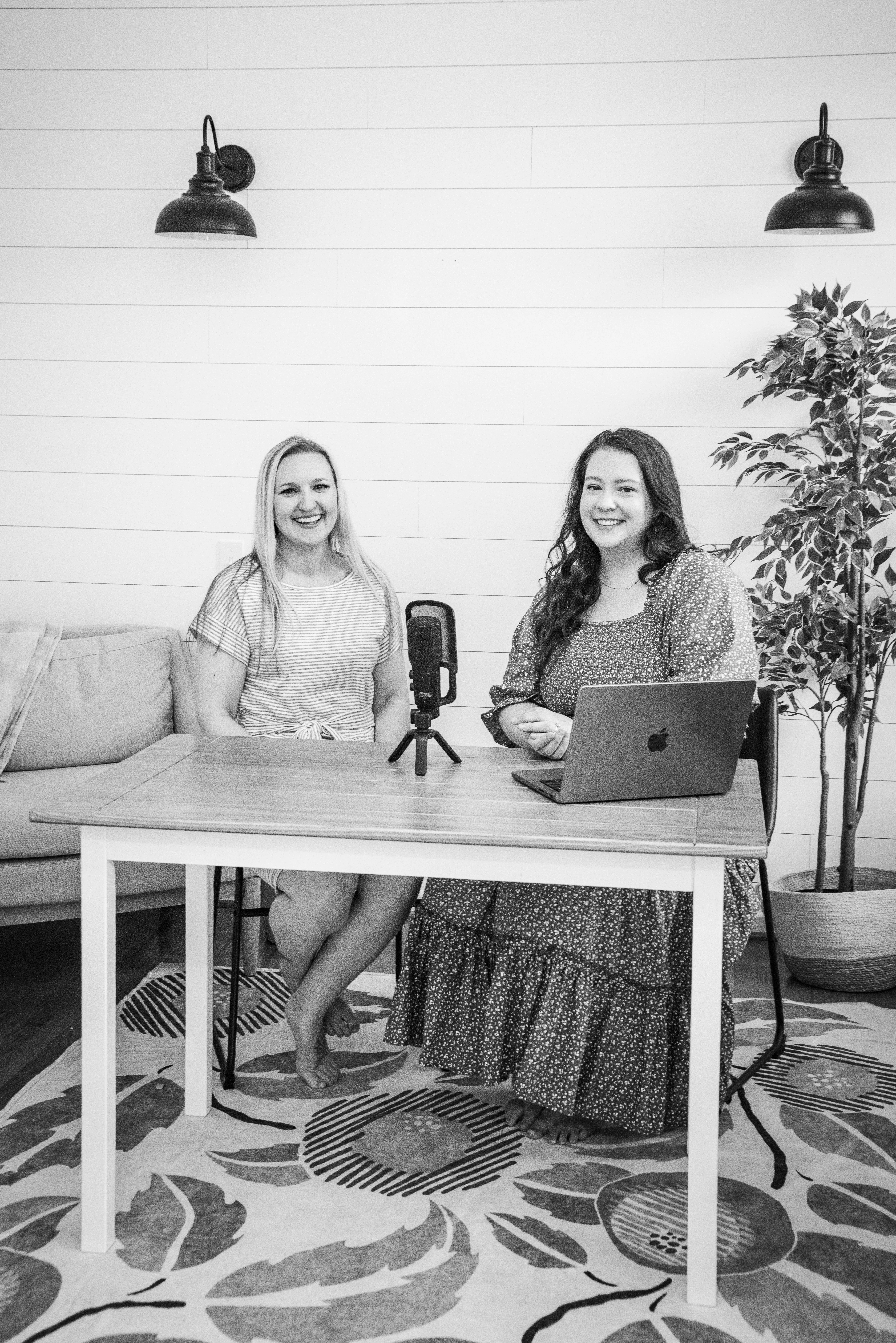 two women sitting at a desk