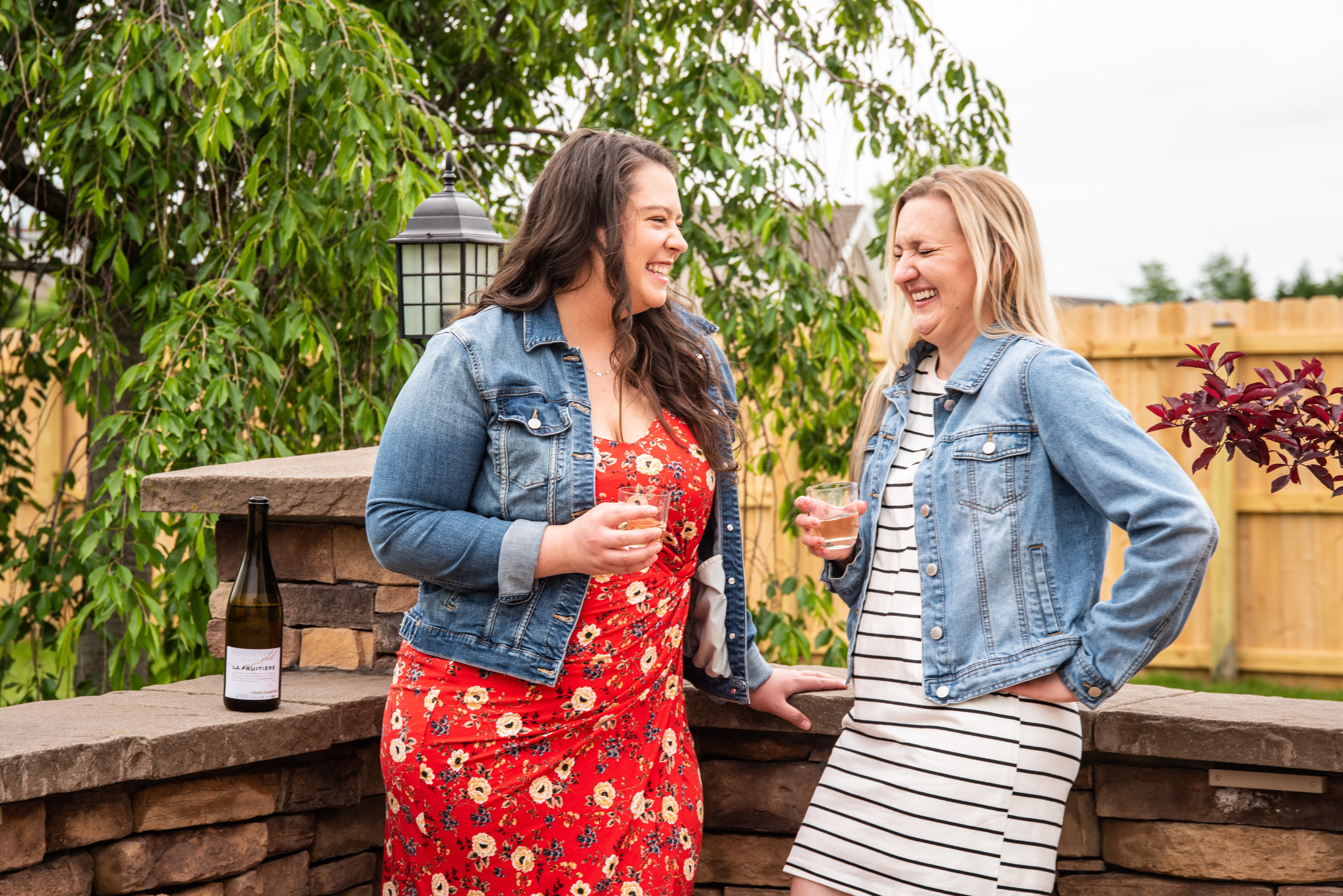 two women drinking wine and chatting