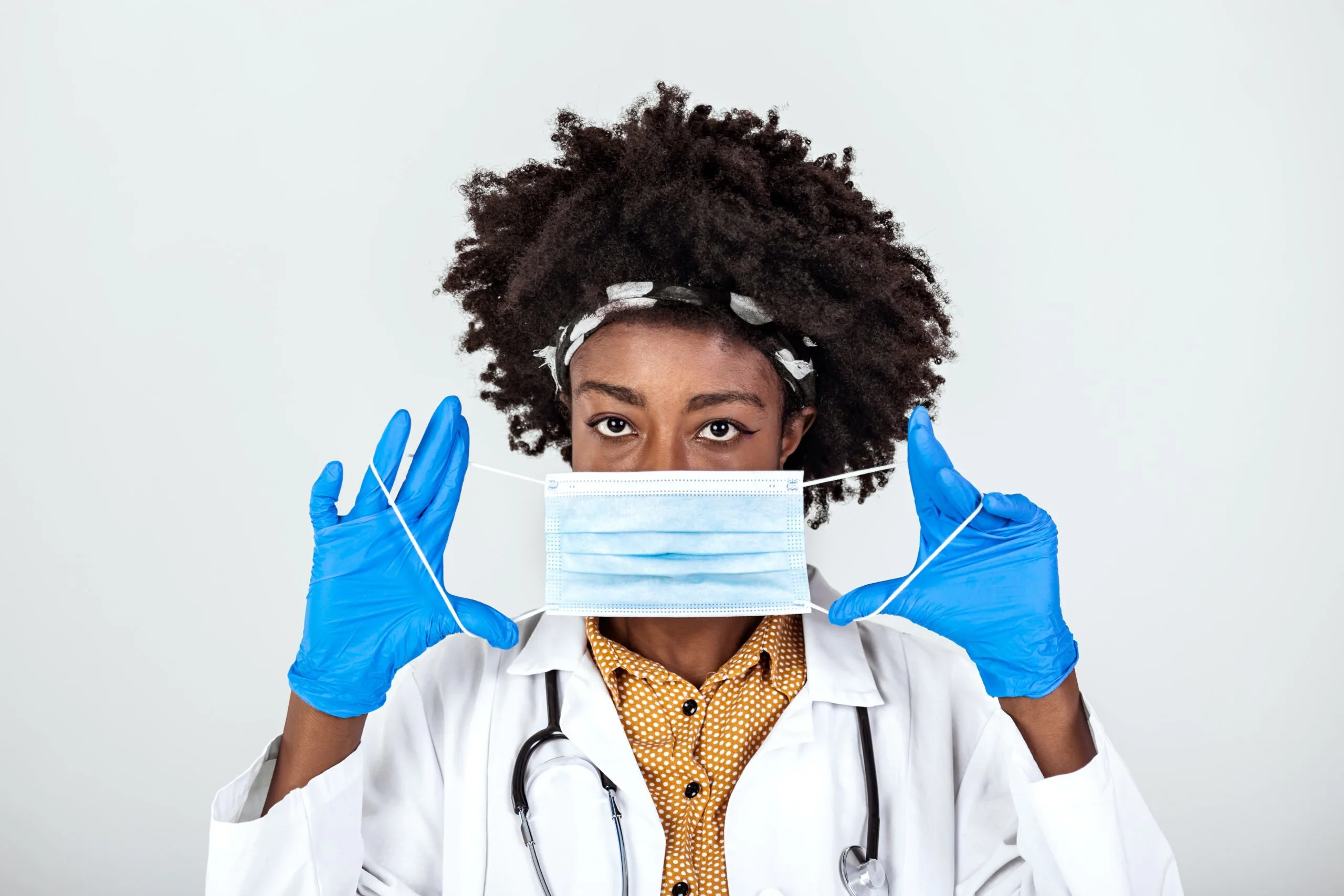 woman putting a mask on