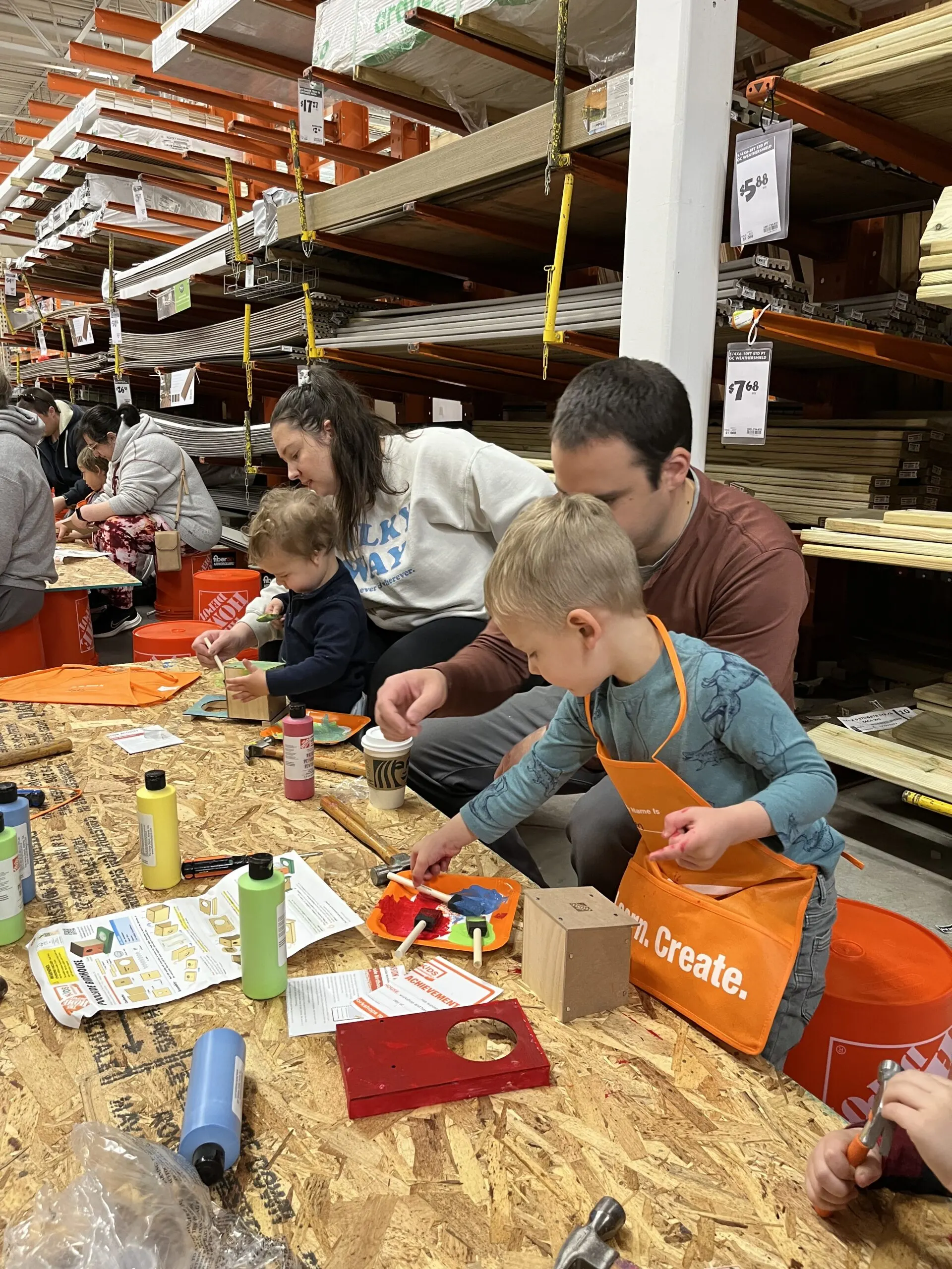 family building a birdhouse