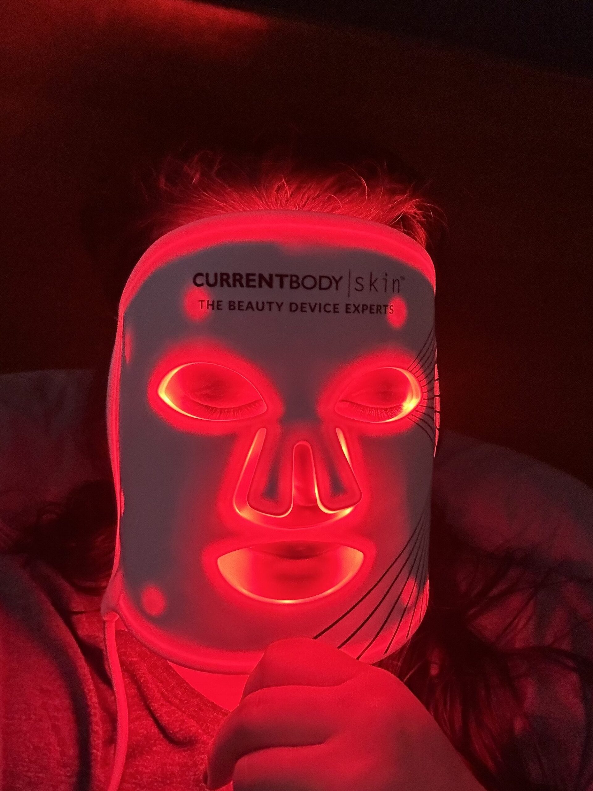 wearing the current body red light therapy mask