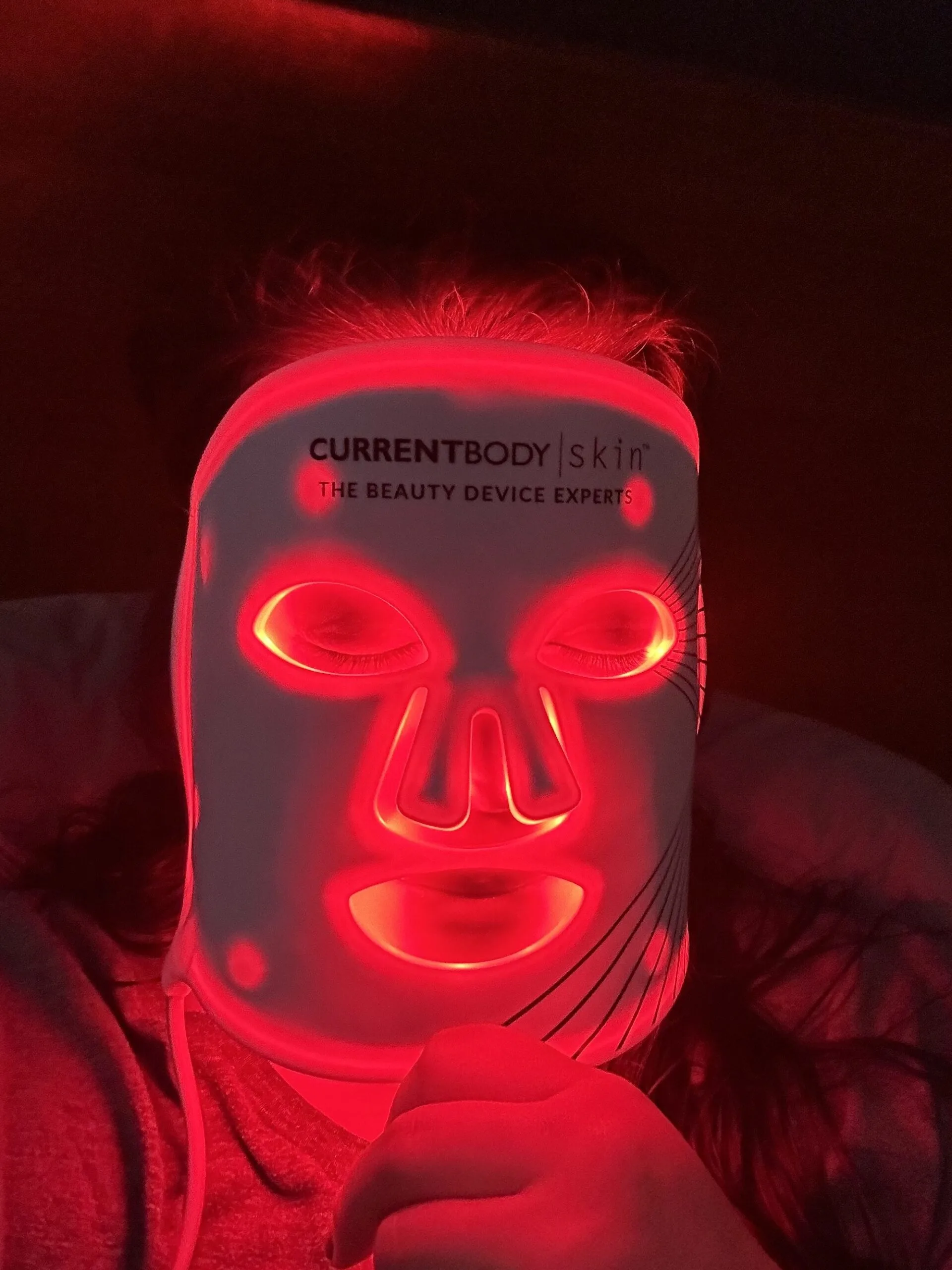wearing the current body red light therapy mask